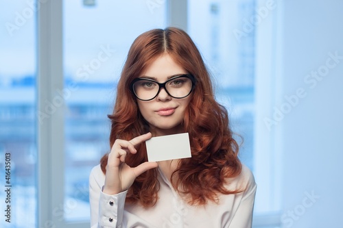 business woman with a business card in her hands office manager © SHOTPRIME STUDIO
