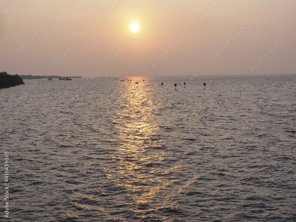 The morning sun rises where tourists are popular to come to visit the sea temple and see the local fishermen lifestyle next to the sea The morning sun rises where tourists are popular to come to visit the sea temple and see the local fishermen lifestyle next to the sea