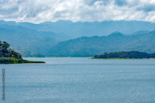 Landscape of water with mountains in background.