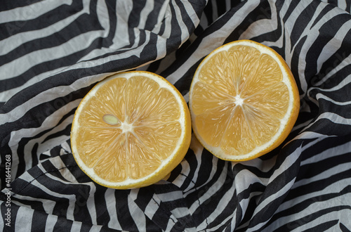 Fresh yellow sliced lemons on beautiful tablecloth