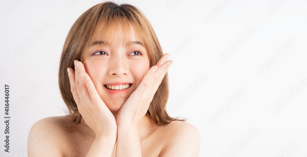 Beautiful xing woman with fresh skin smiling on background