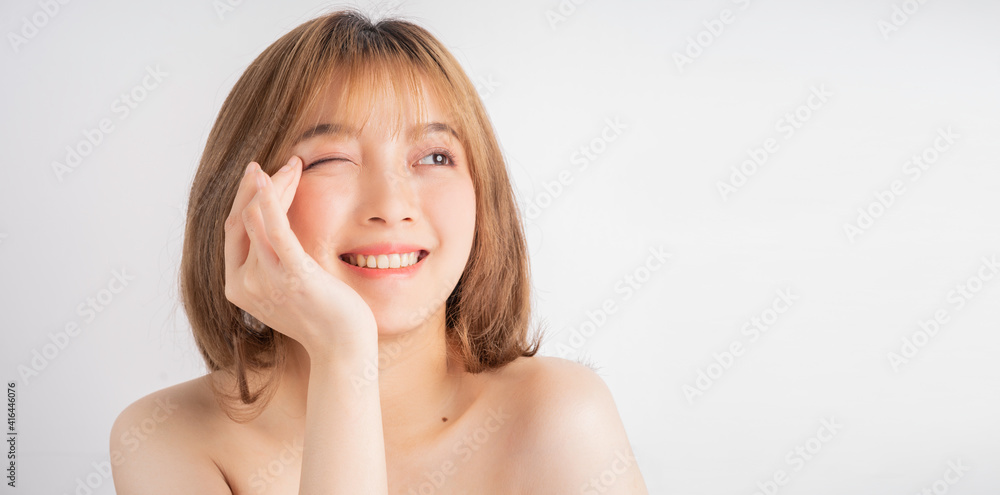 Beautiful xing woman with fresh skin smiling on background Beautiful xing woman with fresh skin smiling on background