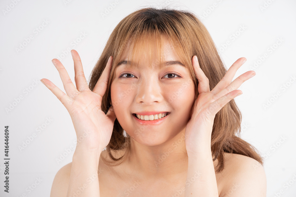 Beautiful xing woman with fresh skin smiling on background Beautiful xing woman with fresh skin smiling on background