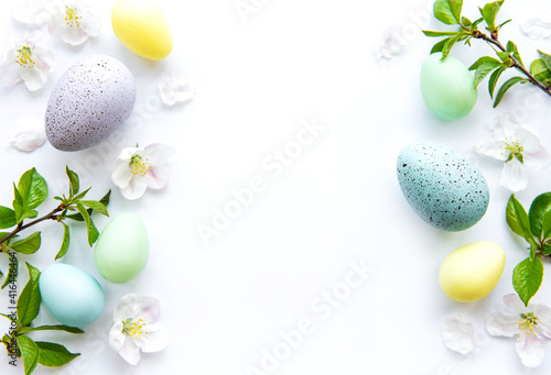 Colorful Easter eggs with spring blossom flowers