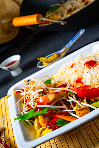 fried sweet and sour chicken with vegetables photo