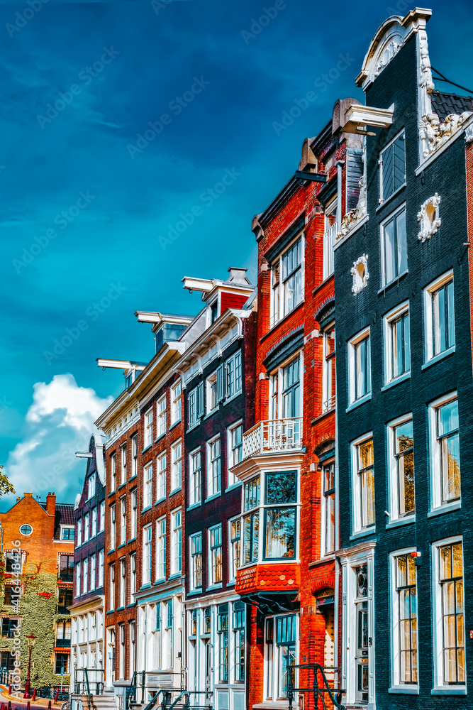 Amsterdam and typical houses with clear summer sky.Netherlands