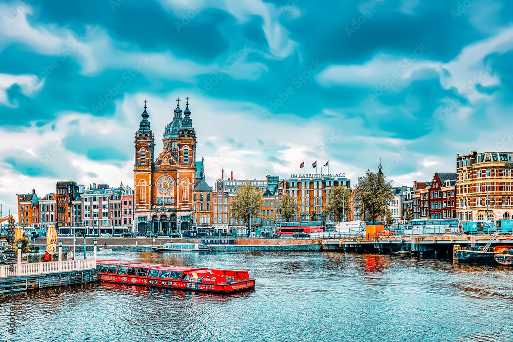 AMSTERDAM, NETHERLANDS - SEPTEMBER 15, 2015: Beautiful views of the streets, ancient buildings, people, embankments of Amsterdam - also call 