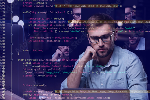 Male programmer working in ...