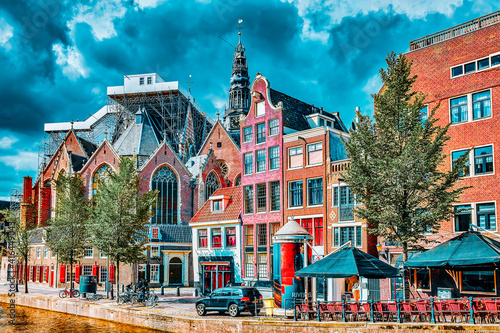 AMSTERDAM, NETHERLANDS - SEPTEMBER 15, 2015: Beautiful views of the streets, ancient buildings, people, embankments of Amsterdam - also call "Venice in the North". Netherlands