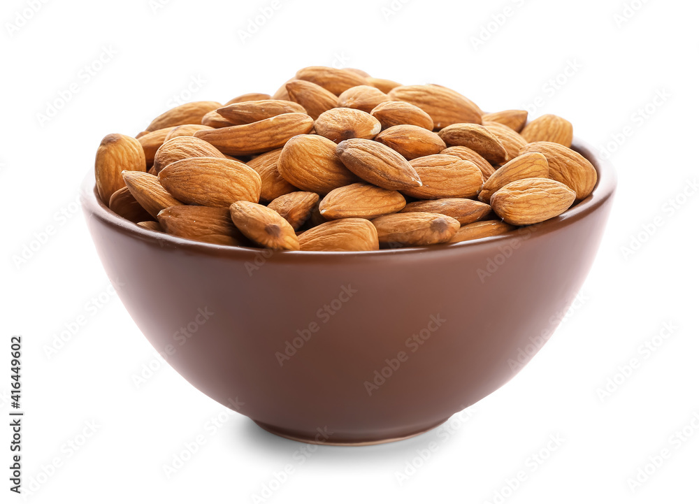 Bowl with healthy almonds on white background