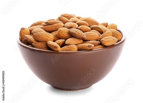 Bowl with healthy almonds on white background