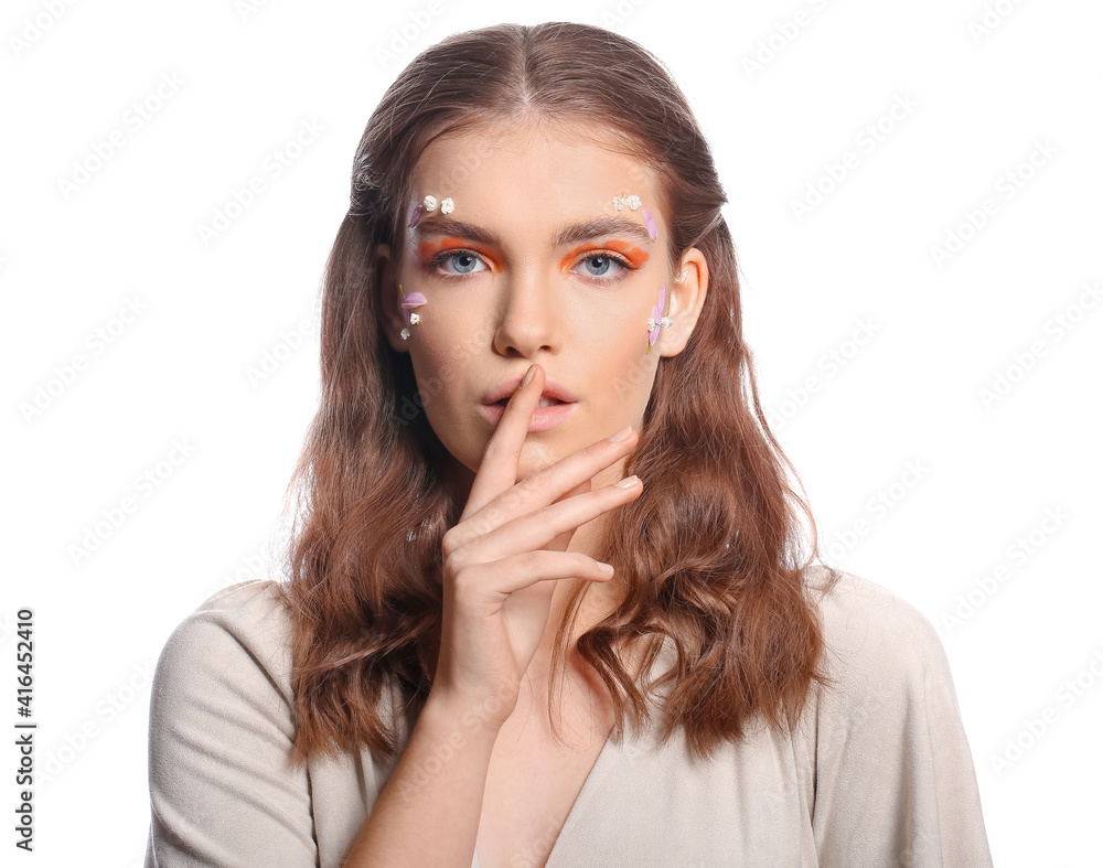 Portrait of beautiful young woman with creative makeup on white background Portrait of beautiful young woman with creative makeup on white background