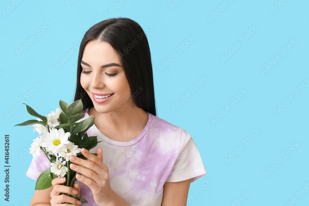 Beautiful young woman with flowers on color background Beautiful young woman with flowers on color background