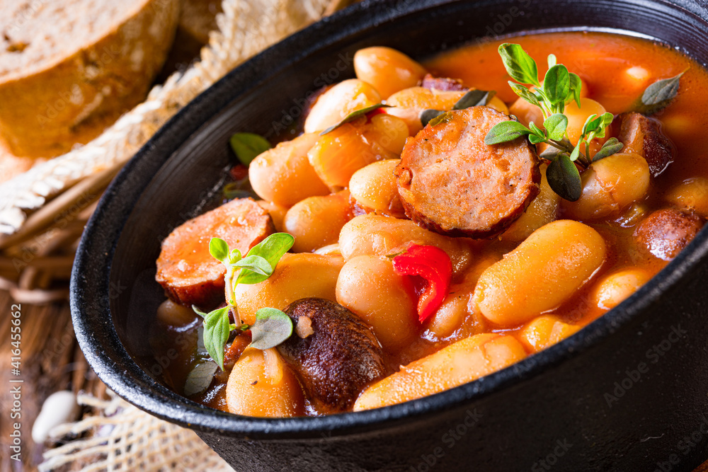 Delicious bean stew with sausage and potato Delicious bean stew with sausage and potato
