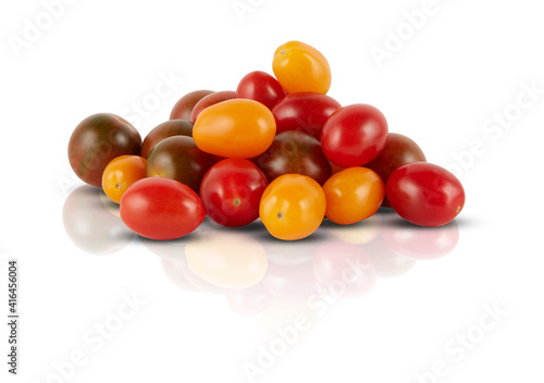 colorful brown yellow red tomatoes on a white background mirror shadows reflections isolated with clipping ​path​