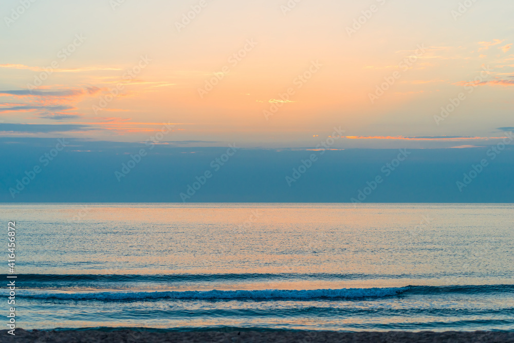 Fototapeta premium scenic view of orange sunset on the sea landscape