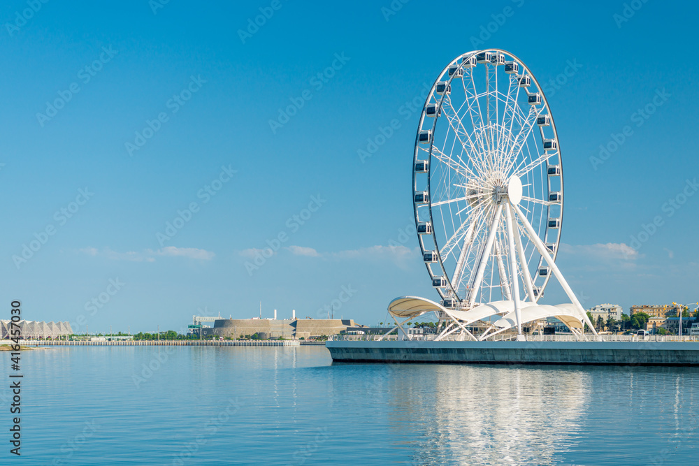 Ferris wheel in front of sky. Big carousel in Baku, Azerbaijan