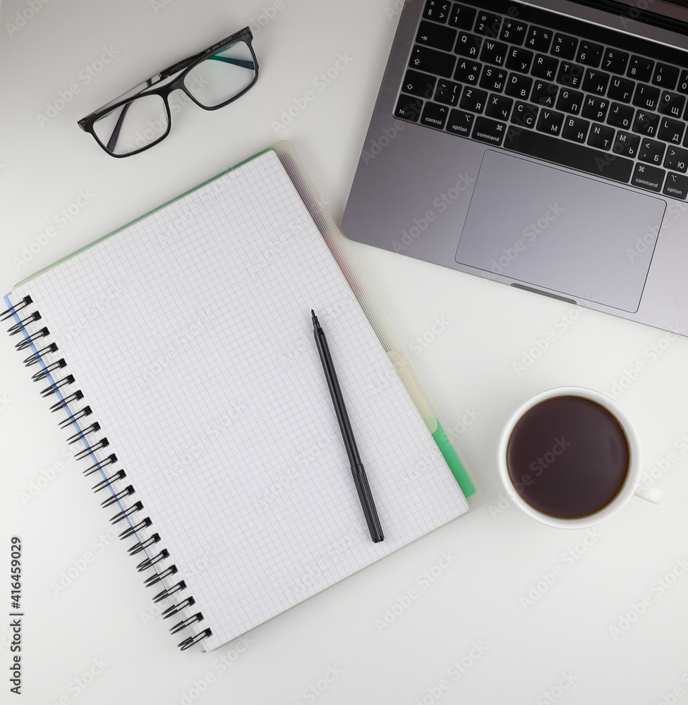 notebook, pen, laptop, glasses and a cup of coffee notebook, pen, laptop, glasses and a cup of coffee