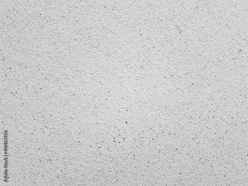 Cement surface texture in light grey earth tone for background.