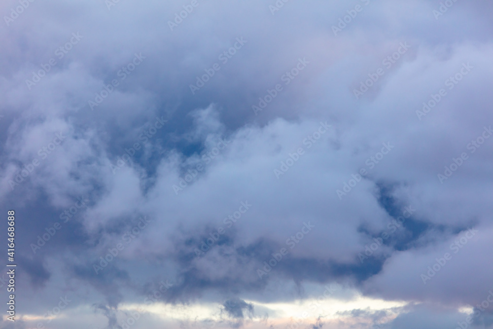 Rain clouds in the sky at sunset