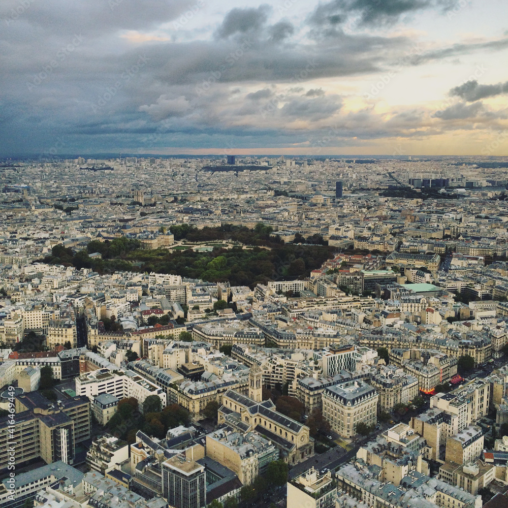 Panoramic view of Paris from the top floor of skyscraper, from above at sunset