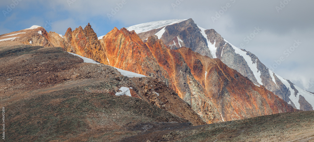 Mountain peaks, colored rocks, contrasting light