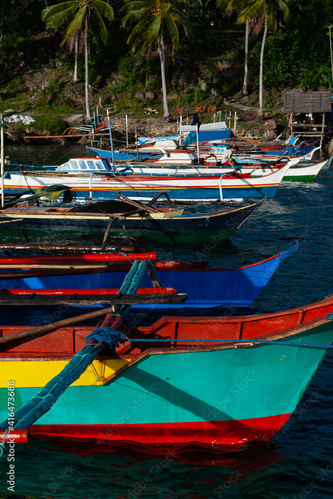 Fishing boats docked by the shore