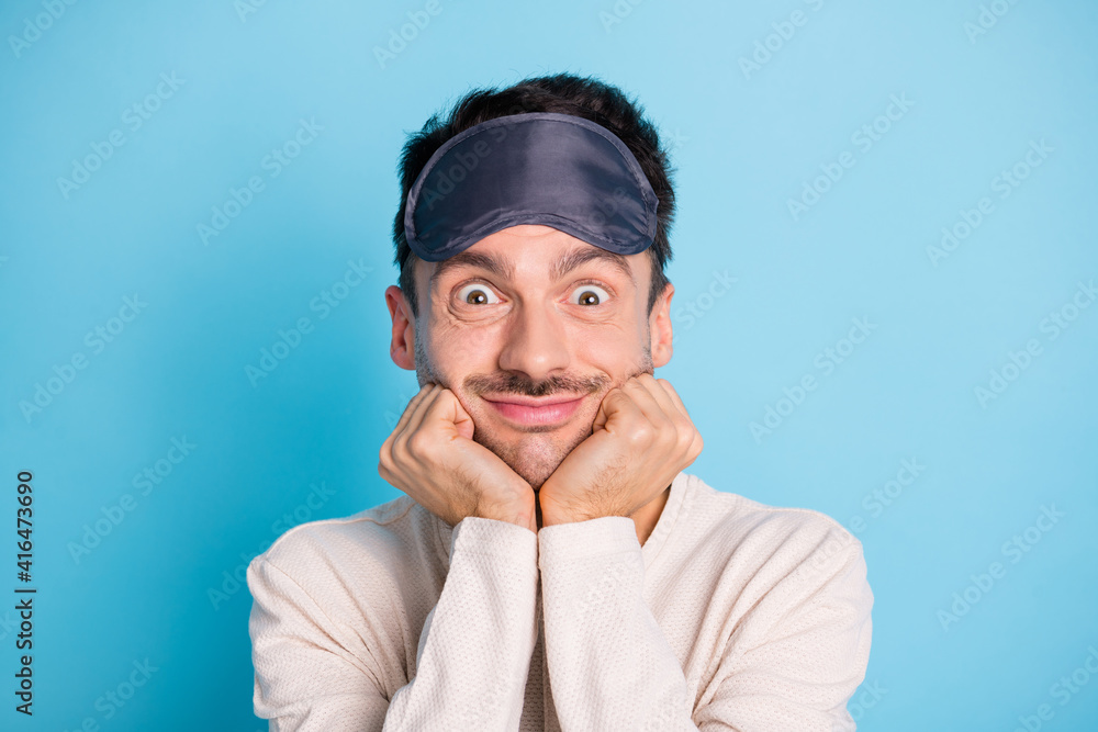 Portrait of nice funny cheery brunet guy wearing sleep mask good mood enjoying relax isolated over bright blue color background Portrait of nice funny cheery brunet guy wearing sleep mask good mood enjoying relax isolated over bright blue color background