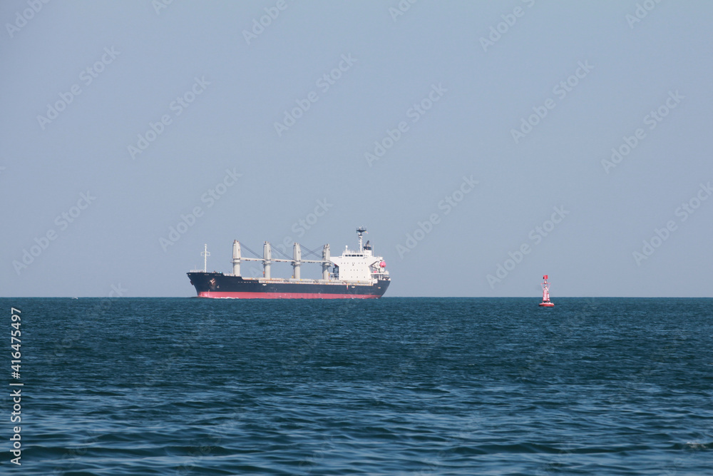 Bulk carrier, cargo ship goes on Red Sea on a sunny day