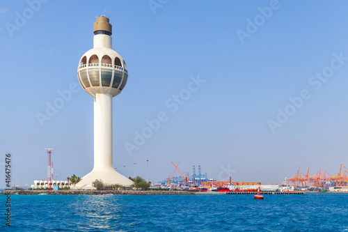 White lighthouse and traffic control tower. Jeddah, Saudi Arabia photo