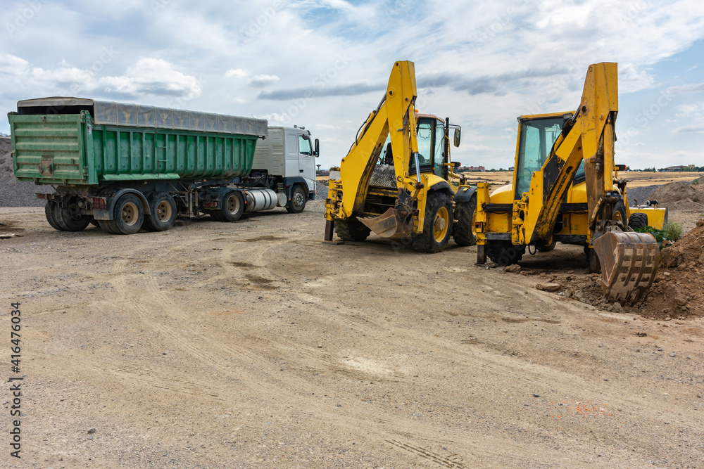 Excavator at a construction site in the extraction of stone and rock Excavator at a construction site in the extraction of stone and rock