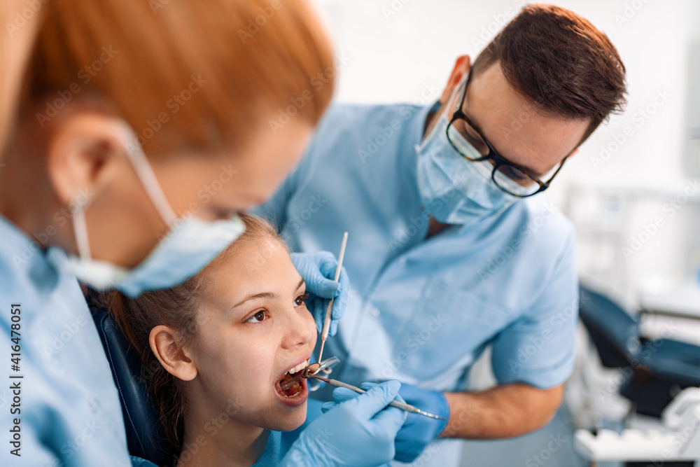 Dentist at work with patient Dentist at work with patient