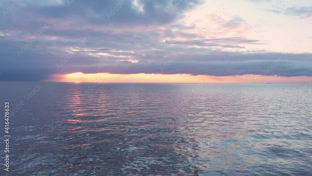 Drone shot zoom in, flight over sea, slide ocean surface in sunrise golden hour. High quality 4k footage Drone shot zoom in, flight over sea, slide ocean surface in sunrise golden hour. High quality 4k footage