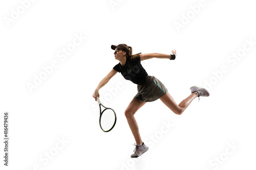 Running. Young caucasian professional sportswoman playing tennis isolated on white background. Training, practicing in motion, action. Power and energy. Movement, ad, sport, healthy lifestyle concept.