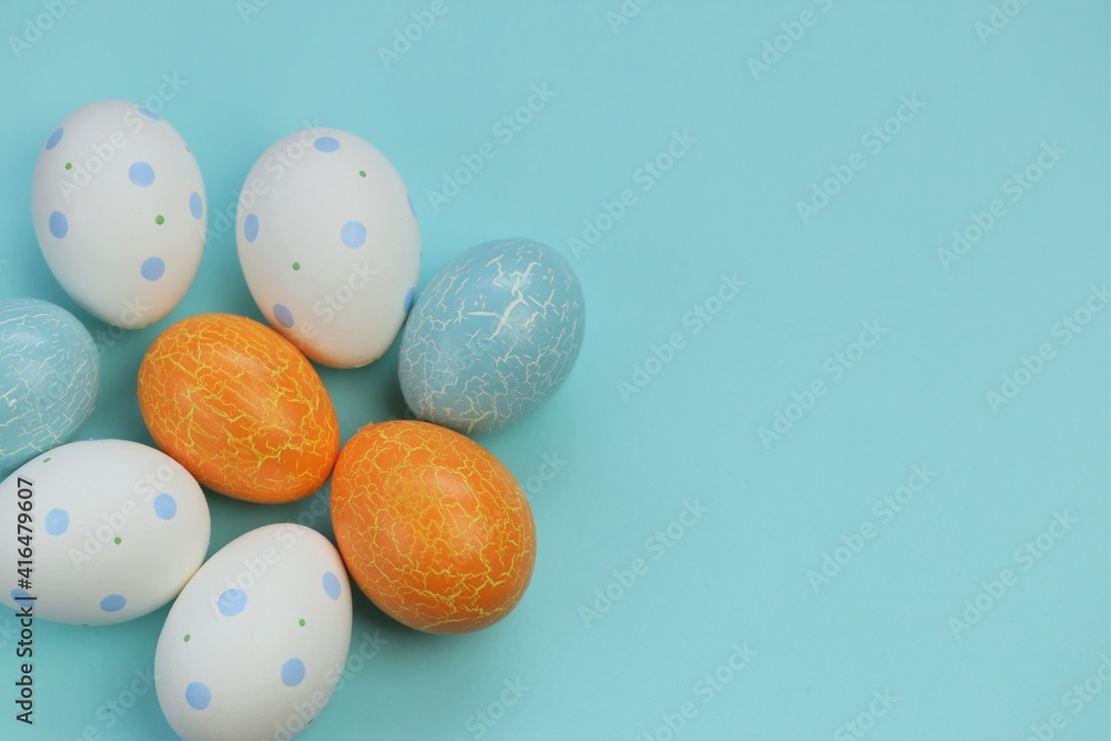 Easter holiday.Multicolored eggs set on a light blue background.Spring festive easter background. copy space. Easter holiday.Multicolored eggs set on a light blue background.Spring festive easter background. copy space.