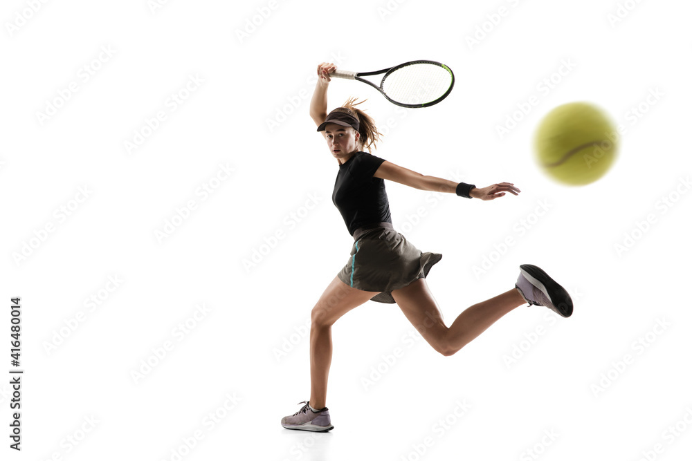 Catching. Young caucasian professional sportswoman playing tennis isolated on white background. Training, practicing in motion, action. Power and energy. Movement, ad, sport, healthy lifestyle concept