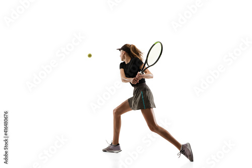 Champion. Young caucasian professional sportswoman playing tennis isolated on white background. Training, practicing in motion, action. Power and energy. Movement, ad, sport, healthy lifestyle concept © master1305