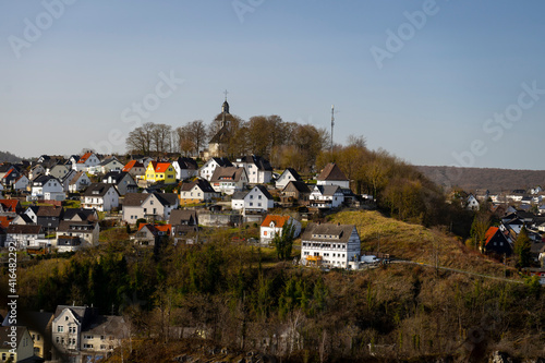 view of a church on a hill in the city of Warstein in the Sauerland area, Germany photo