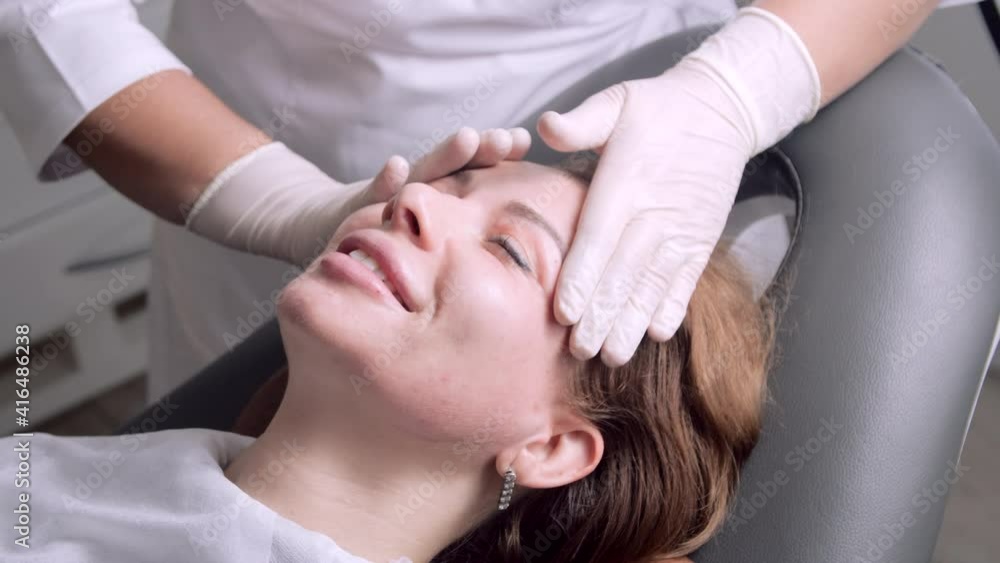 custom made wallpaper toronto digitalDoctor in white medical gloves doing relaxing facial massage to young woman. Professional cosmetologist or beautician doing facial massage in the beauty salon to female smiling patient.