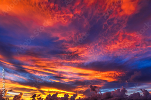 nature background of Summer pink and red sky with moving clouds. sun shining at sunset of Seychelles islands at sunset with copy space.
