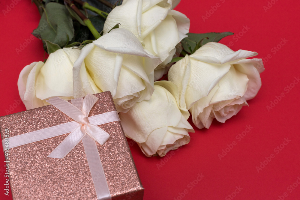 Postcard. White roses on a blue background with a pink gift box. Congratulations on March 8, Valentine's Day, Mother's Day, Birthday, Anniversary, Easter, Wedding, Teacher's Day, to women. Postcard. White roses on a blue background with a pink gift box. Congratulations on March 8, Valentine's Day, Mother's Day, Birthday, Anniversary, Easter, Wedding, Teacher's Day, to women.