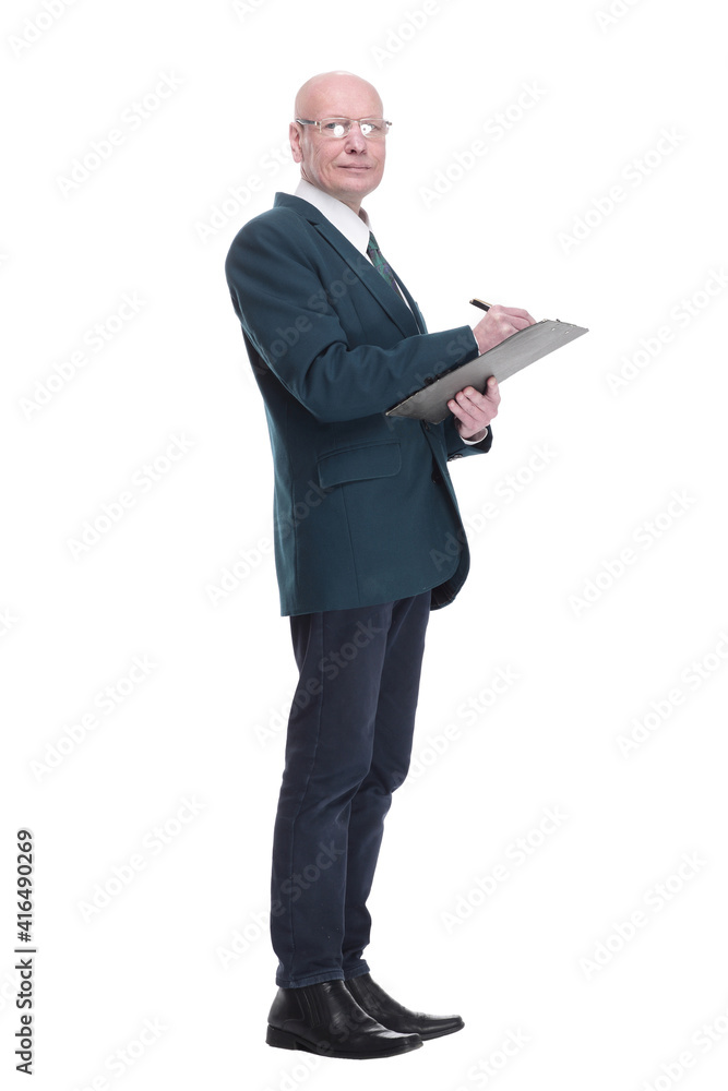 serious business man writing something in the clipboard. serious business man writing something in the clipboard.