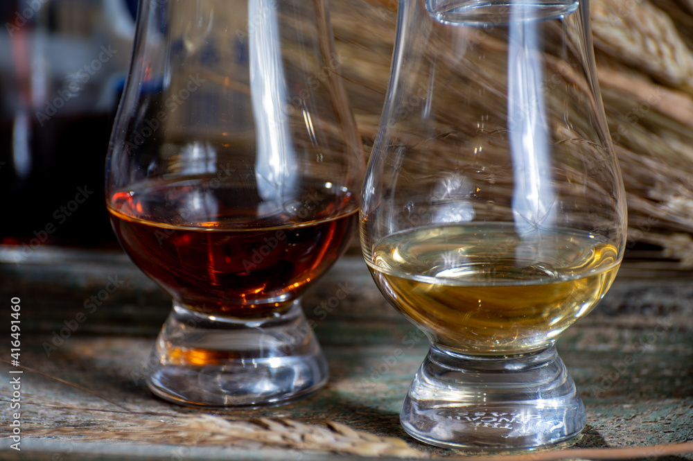 Glasses of scotch whisky served in bar in Edinburgh, Scotland, UK Glasses of scotch whisky served in bar in Edinburgh, Scotland, UK
