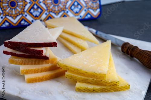 Spanish snacks tapas, variety of sliced goat, sheep, manchego cheeses
