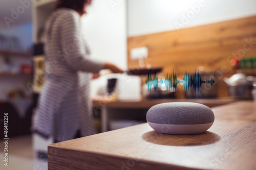 Smart speaker concept in kitchen to help with cooking and baking © David Ferencik
