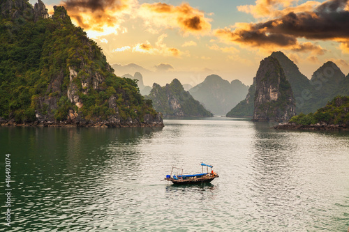 View of ships and islands in Halong Bay at sunset, Vietnam.