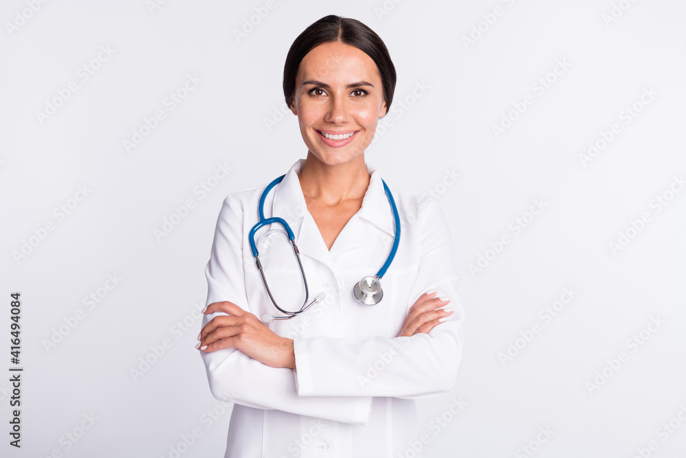 Photo of cute charming young lady doctor dressed uniform smiling isolated white color background Photo of cute charming young lady doctor dressed uniform smiling isolated white color background