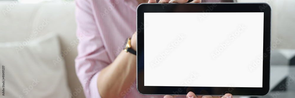 Woman holds black tablet in her hands. Review of technique by blogger concept Woman holds black tablet in her hands. Review of technique by blogger concept