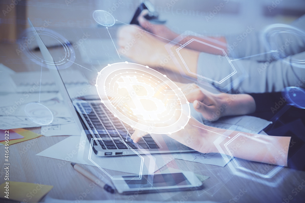 Double exposure of woman hands typing on computer and crypto market theme hologram drawing. Blockchain concept. Double exposure of woman hands typing on computer and crypto market theme hologram drawing. Blockchain concept.