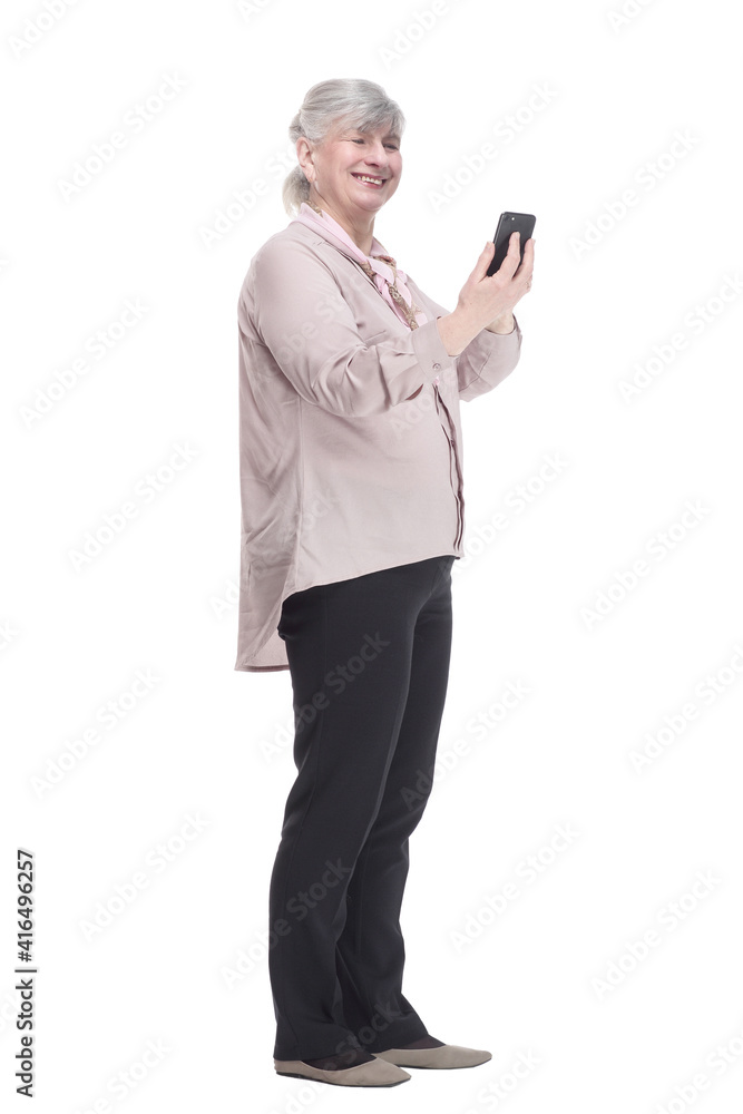 smiling elderly woman with a smartphone looking at you. smiling elderly woman with a smartphone looking at you.